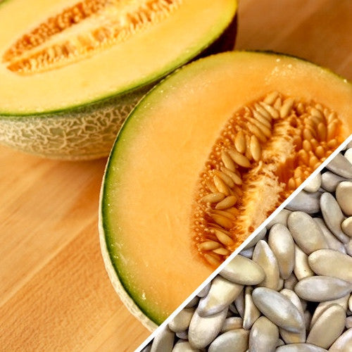Honey Rock cantaloupe melon cut open with seeds close-up on wooden surface
